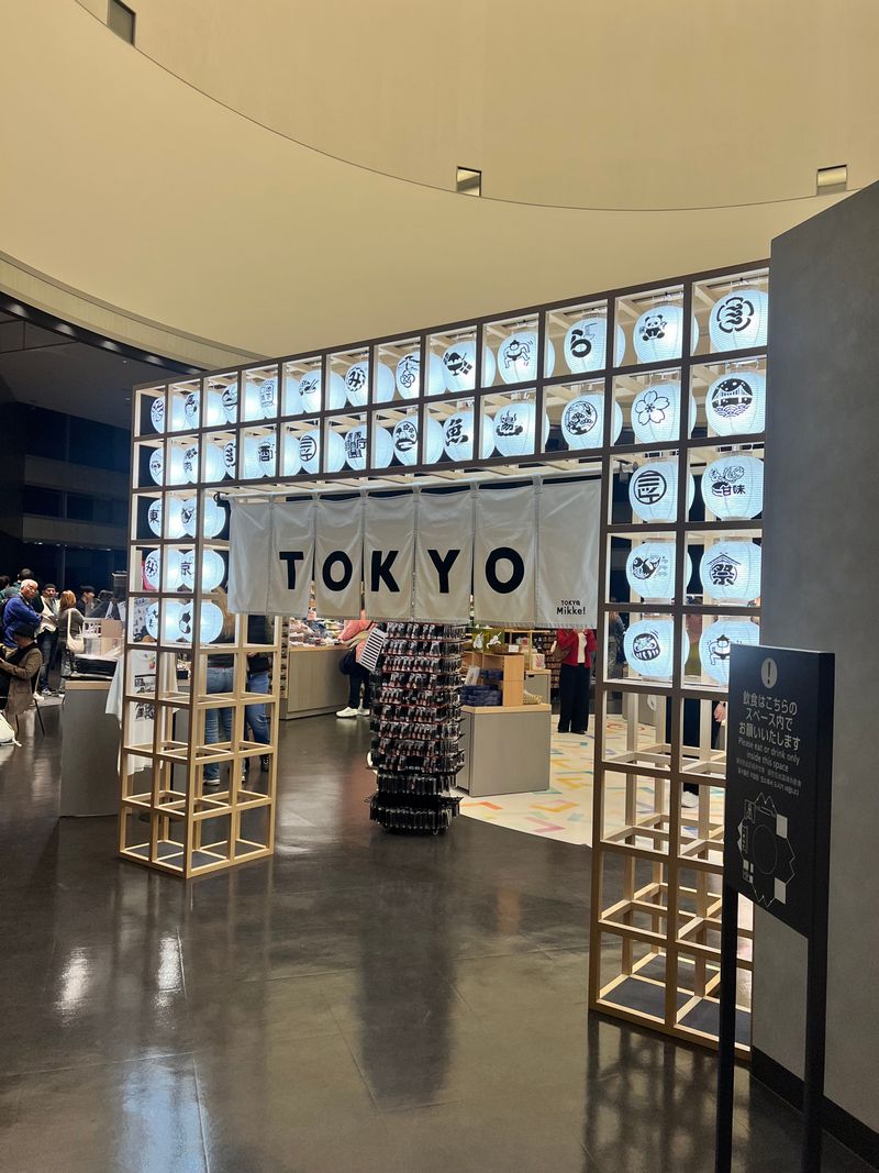 A bold Tokyo sign inside a station concourse